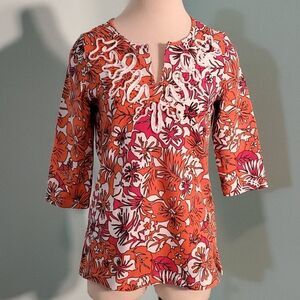 Palm Island top, size small. Orange floral print.